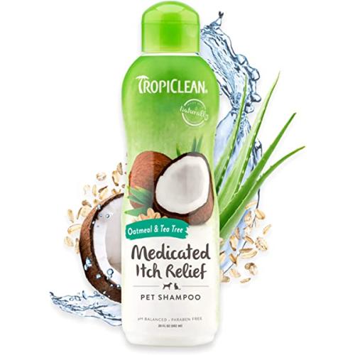 Flaske med TropiClean Oatmeal & Tea Tree Shampoo til kæledyr